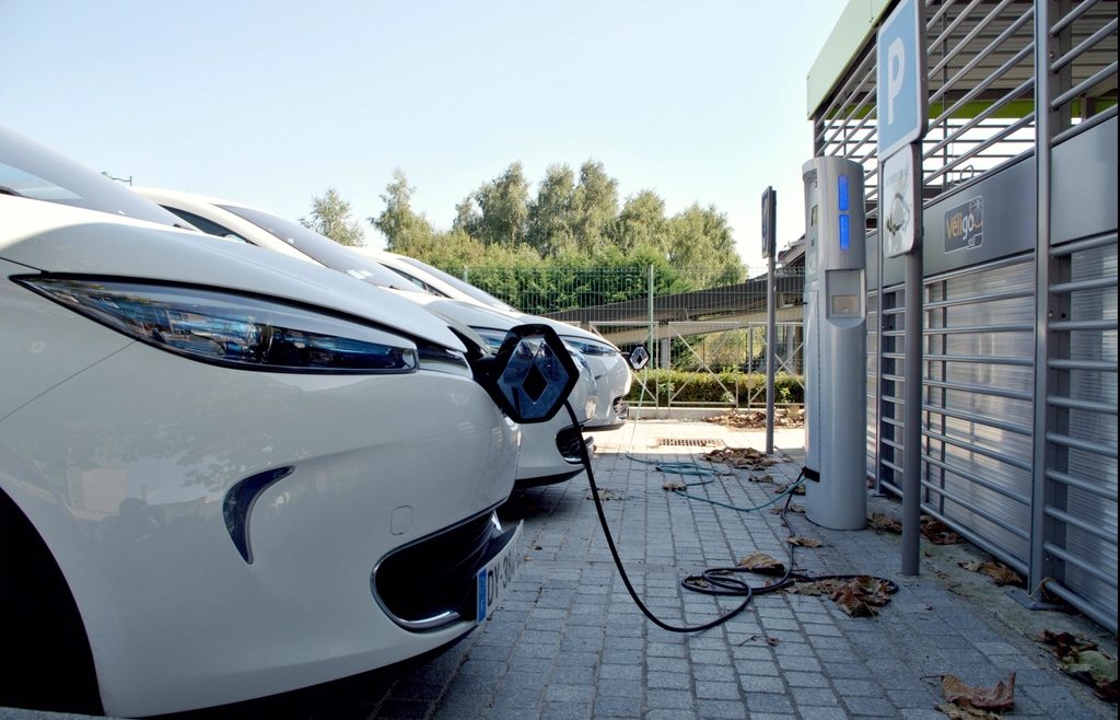 Electric car plugged into a public street charger